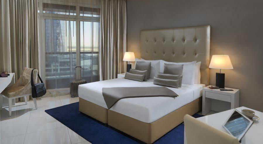 Damac Maison The Vogue Dubai Exterior foto A bedroom at the hotel